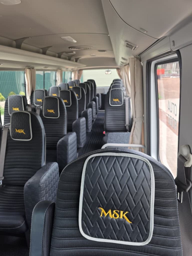 Automatic sliding door and spacious bus interior